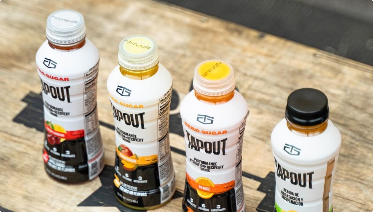 Different flavor TapouT bottles lined up